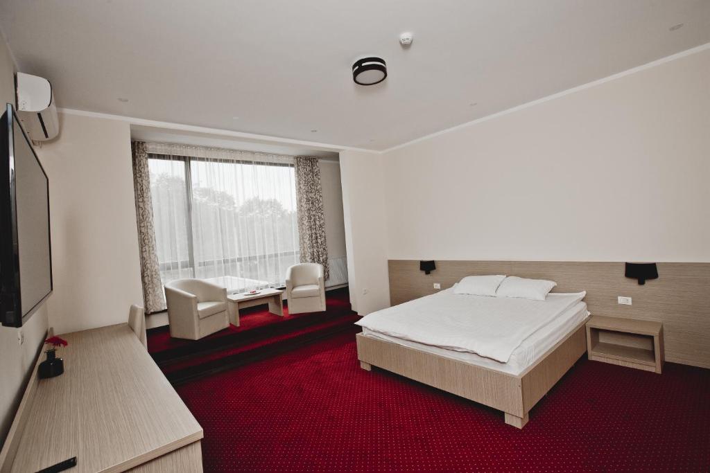 Postel nebo postele na pokoji v ubytování Hotel Evergreen