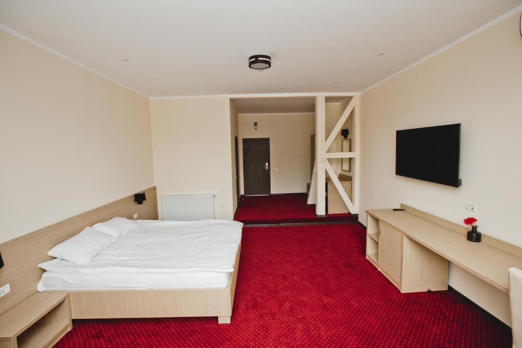 Postel nebo postele na pokoji v ubytování Hotel Evergreen