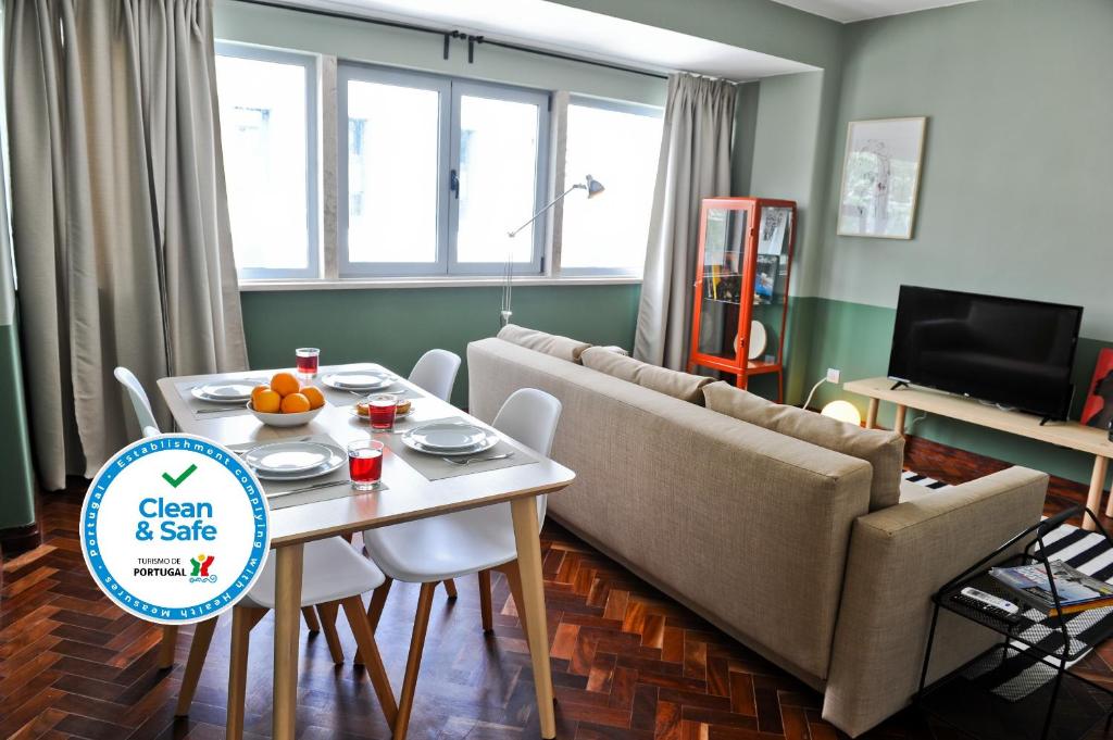 a living room with a couch and a table at To Beer or not to Beer Apartment 5A in Lisbon
