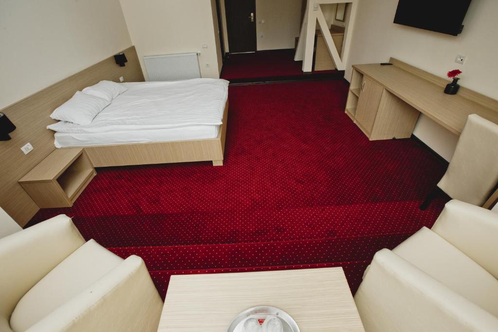 Postel nebo postele na pokoji v ubytování Hotel Evergreen