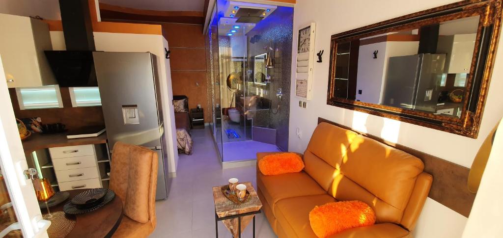 a living room with a couch and a shower at Yela in Zadar