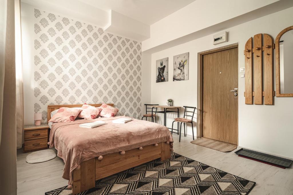 Posteľ alebo postele v izbe v ubytovaní ZAKOHOME- Apartamenty Kościelisko Centrum