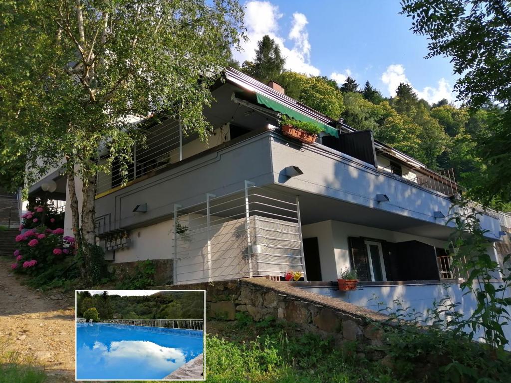 ein Haus mit Pool davor in der Unterkunft Casa Agnese, tra lago e montagna in Calceranica al Lago