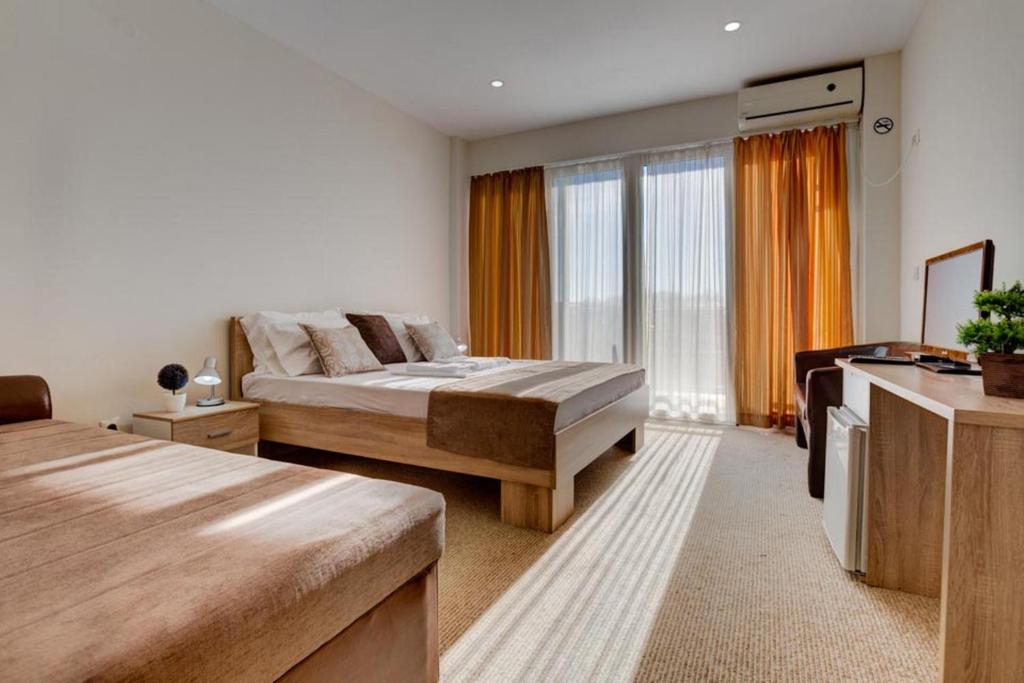 Postel nebo postele na pokoji v ubytování Hotel Zan