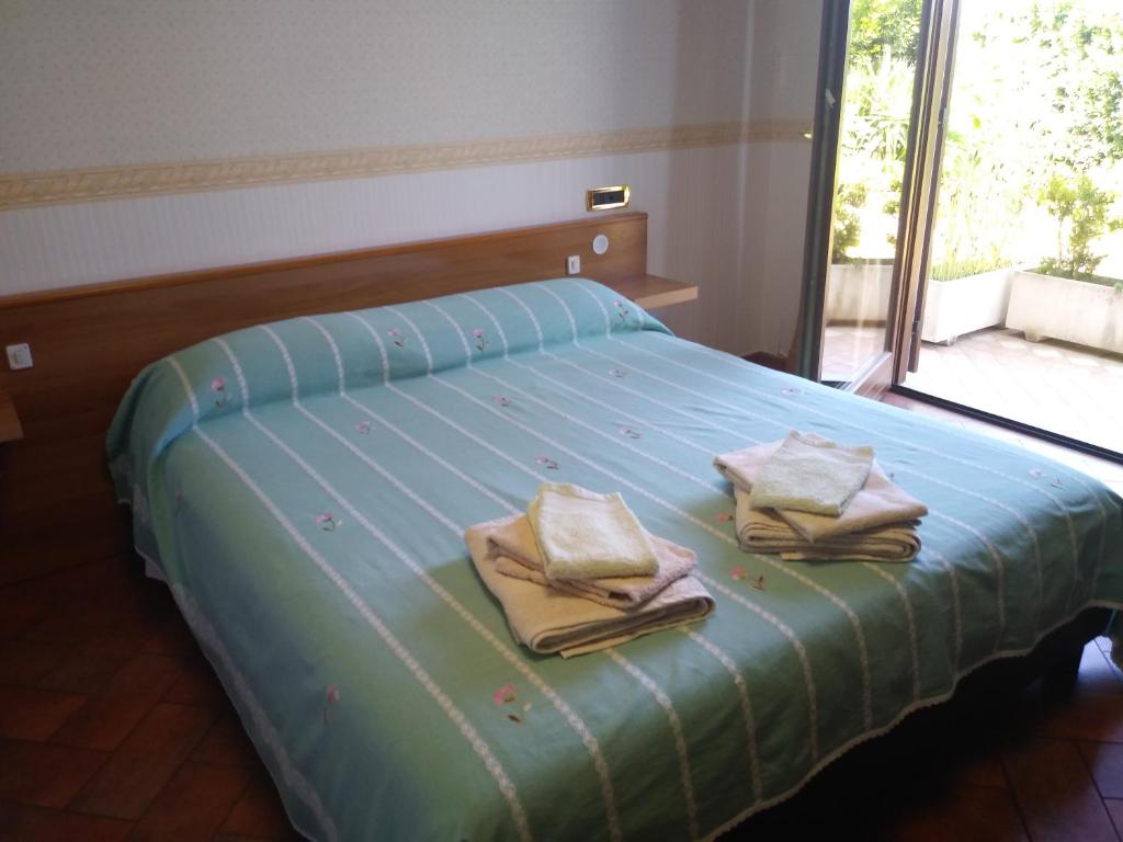เตียงในห้องที่ Casa Degli Ulivi