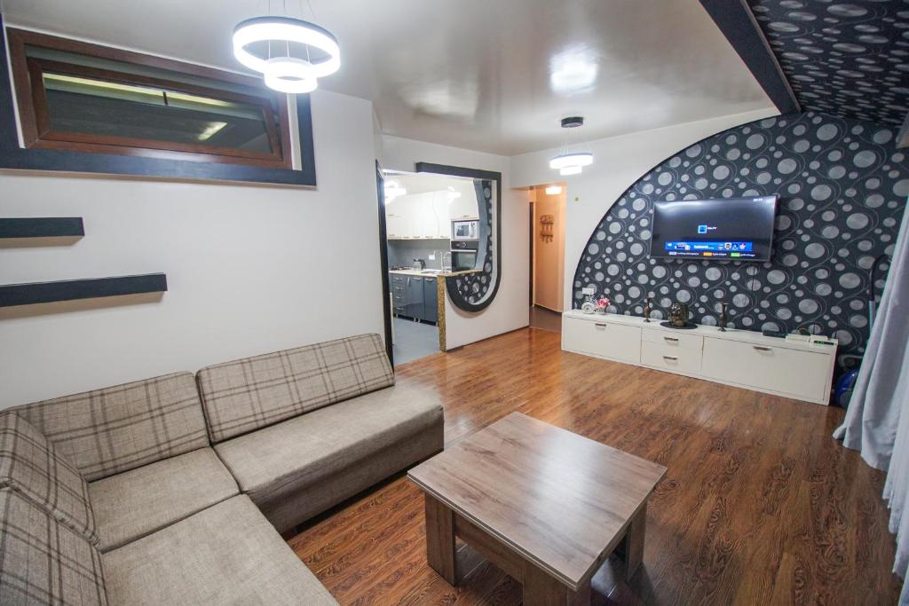 a living room with a couch and a table at jako in Batumi