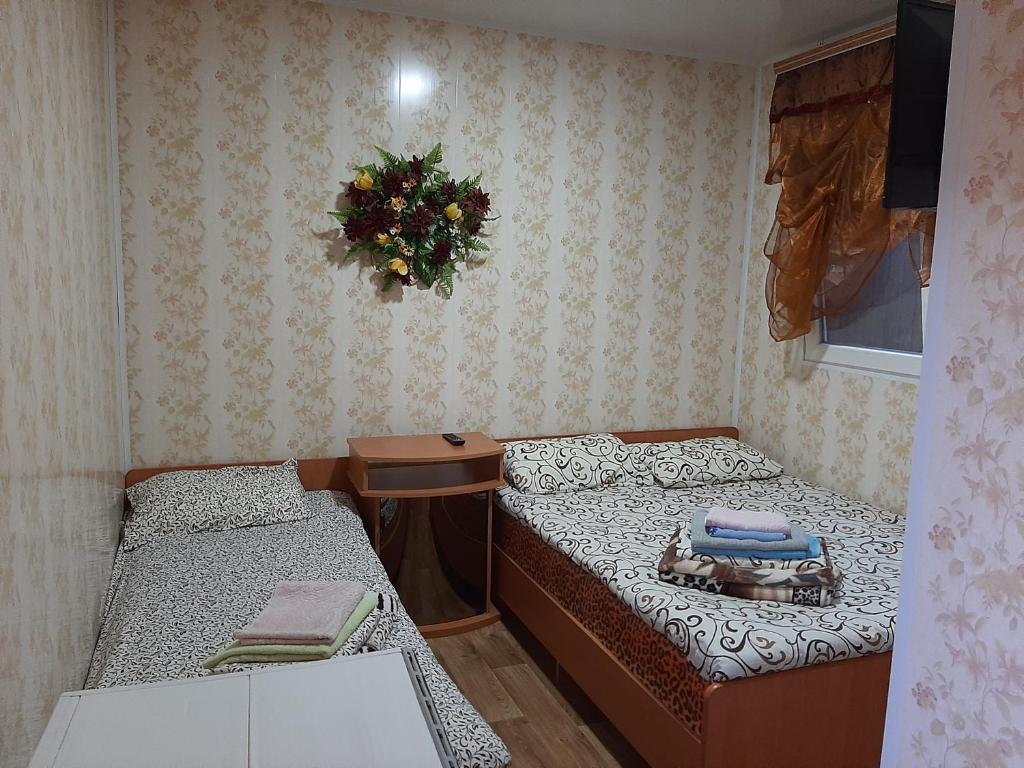 Postel nebo postele na pokoji v ubytování Mini Hotel Уютный дворик