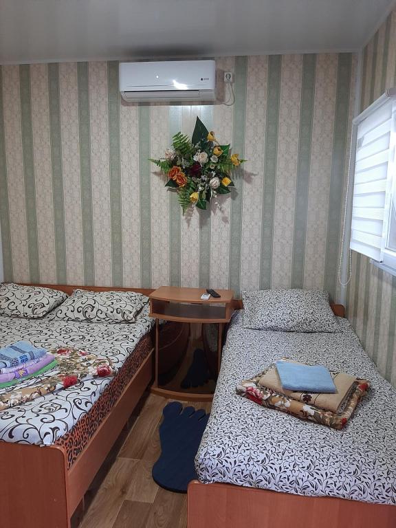 Postel nebo postele na pokoji v ubytování Mini Hotel Уютный дворик