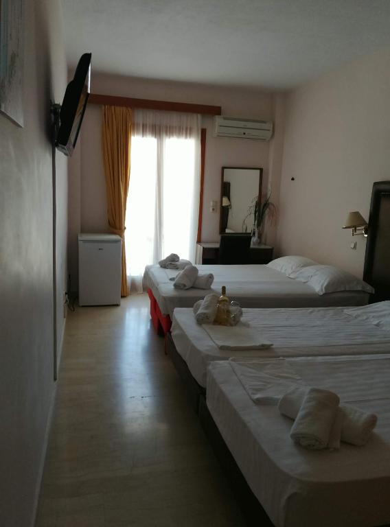 Postel nebo postele na pokoji v ubytování Verdelis Inn