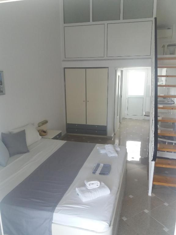 Postel nebo postele na pokoji v ubytování Pegasus Hotel