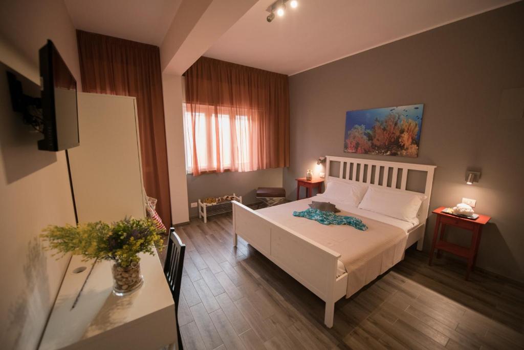 Кровать или кровати в номере Sale e Sabbia