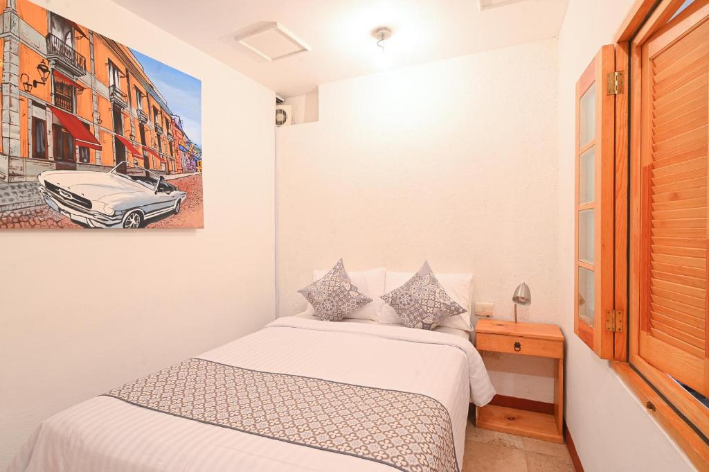 Postel nebo postele na pokoji v ubytování Hotel Meson Cuevano