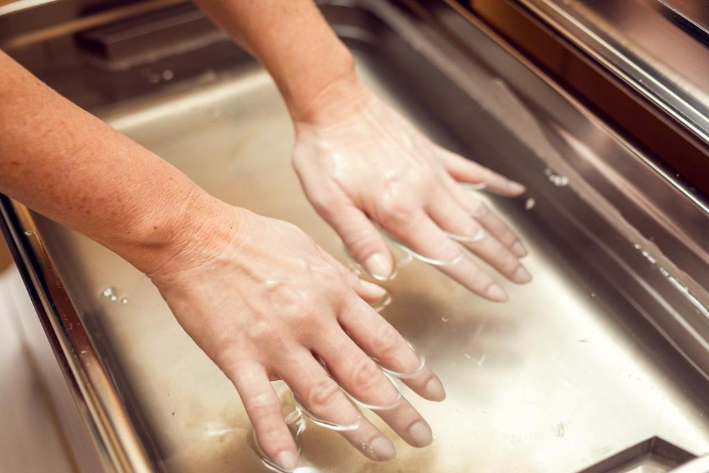 two people holding their hands on a stove at Spa Hotel Imperial in Karlovy Vary