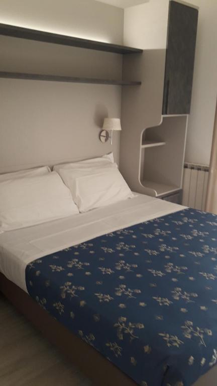Postel nebo postele na pokoji v ubytování Hotel Cinzia