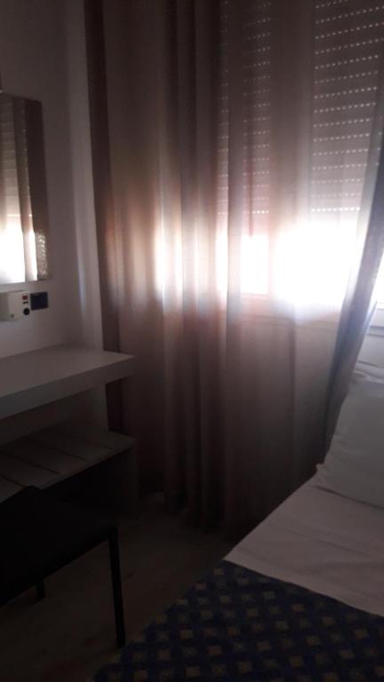 Postel nebo postele na pokoji v ubytování Hotel Cinzia