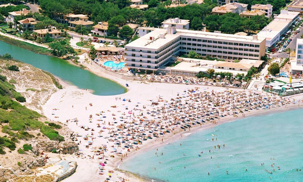an aerial view of a beach with people in the water at Son Bauló in Can Picafort