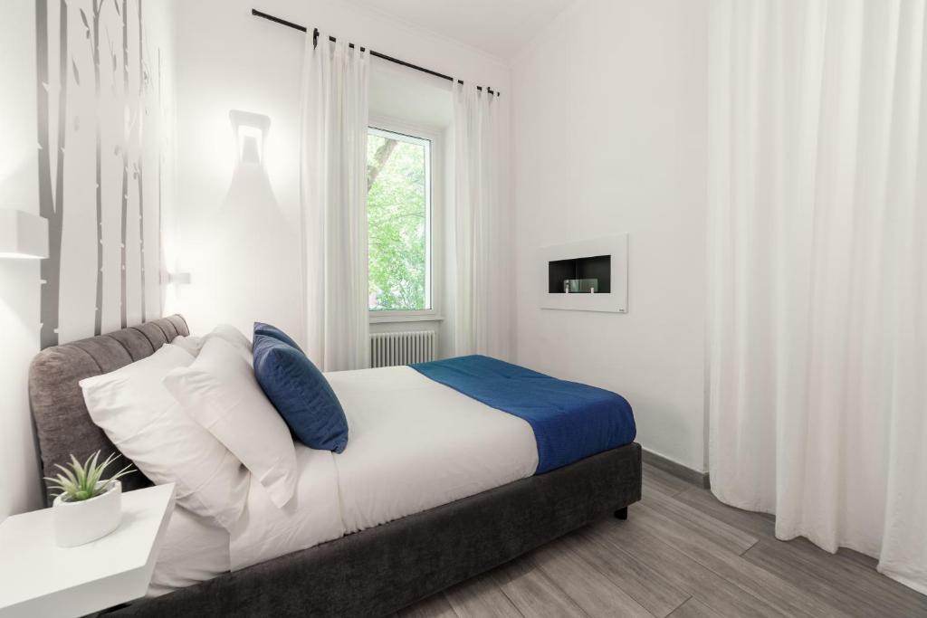 Łóżko lub łóżka w pokoju w obiekcie Domus Quiritum Elite, Vatican luxury apartment