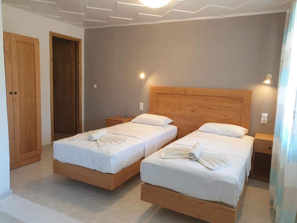 Postel nebo postele na pokoji v ubytování Apartments and Studios Xenophon