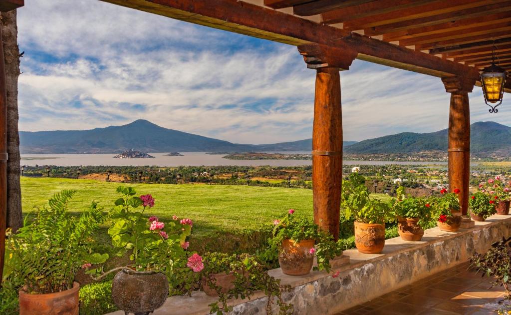 a view from a porch with potted plants at Eco Hotel Ixhi in Pátzcuaro