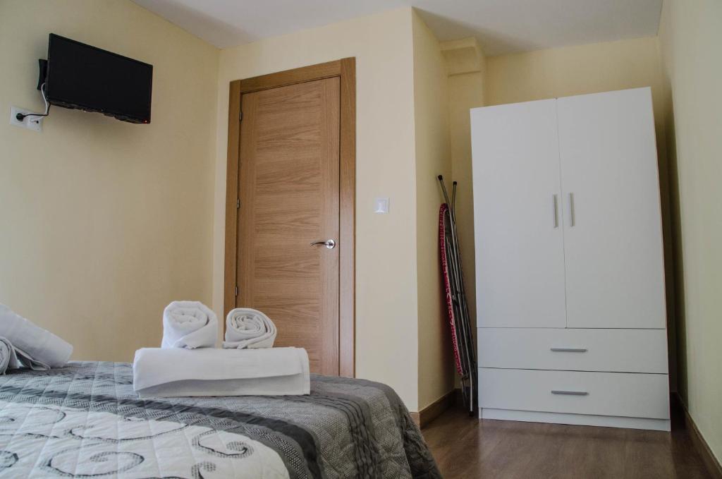Posteľ alebo postele v izbe v ubytovaní La Casita de la Plaza