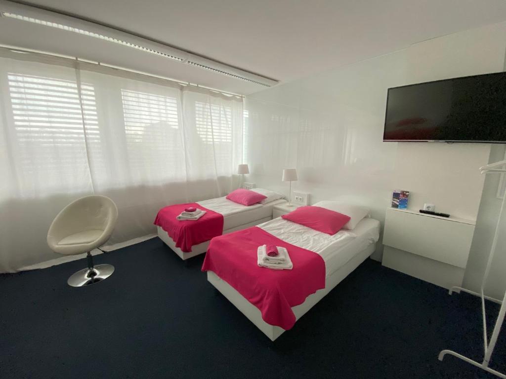 Postel nebo postele na pokoji v ubytování Business Hotel Wiesbaden PRIME