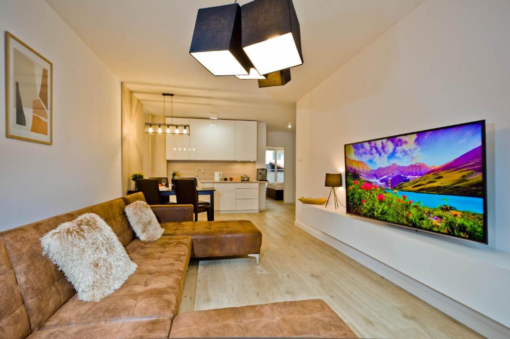 TV a/nebo společenská místnost v ubytování PORTY b103 Nadmorskie Tarasy pool sauna parking