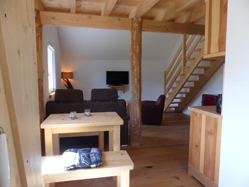 a living room with a couch and a table at Apartment Schritte in Hinterweiler