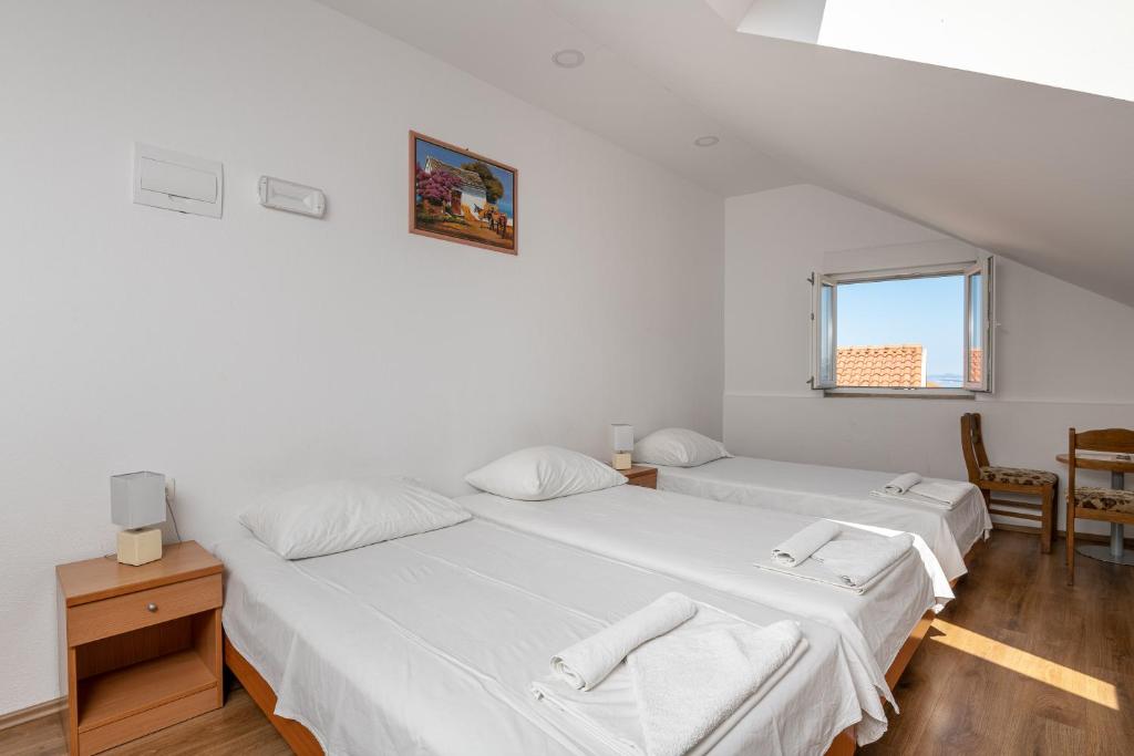 Postel nebo postele na pokoji v ubytování Country House Pansion