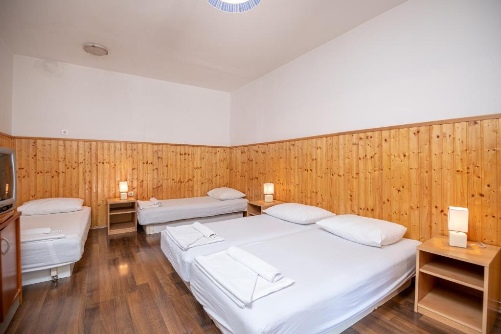 Postel nebo postele na pokoji v ubytování Country House Pansion