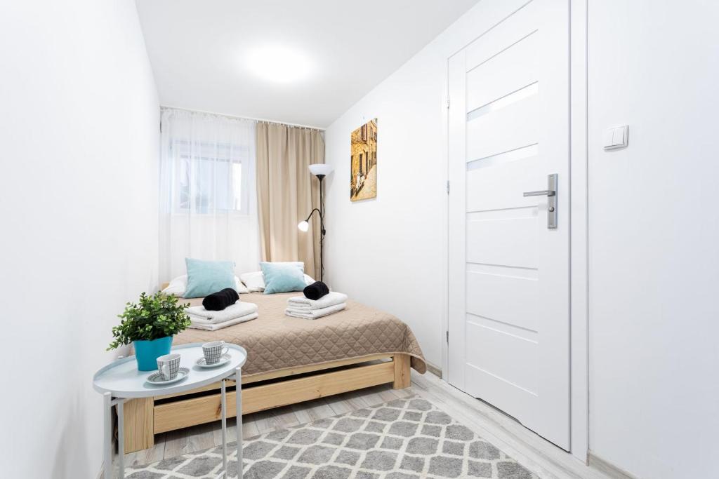 Posteľ alebo postele v izbe v ubytovaní Apartament Palermo