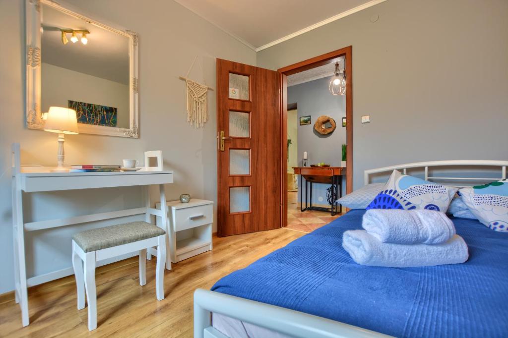 Posteľ alebo postele v izbe v ubytovaní Apartamenty BIESZCZADZKI Anioł