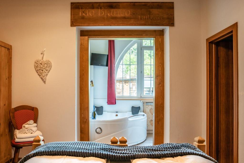 Postel nebo postele na pokoji v ubytování Hotel Rio Bianco