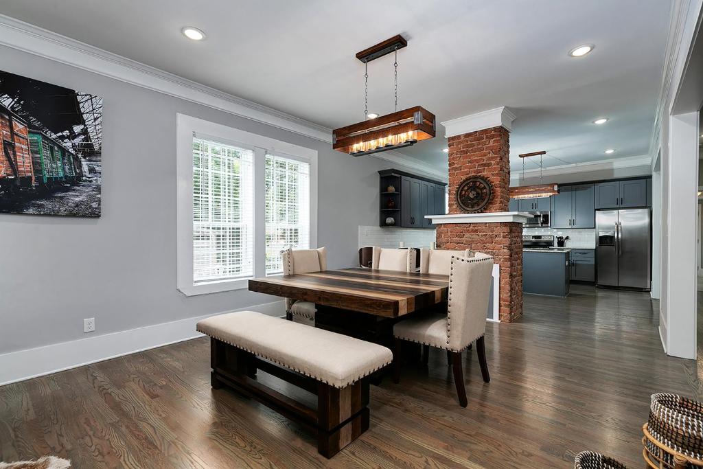 a kitchen and dining room with a table and chairs at Atlanta Luxury Vacation Home by Downtown & Airport in Atlanta