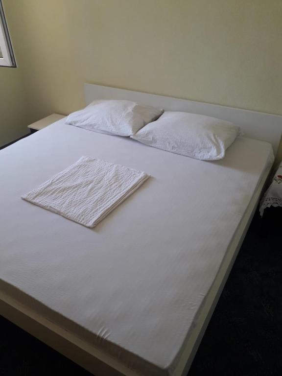 Postel nebo postele na pokoji v ubytování Apartmani Jogunica