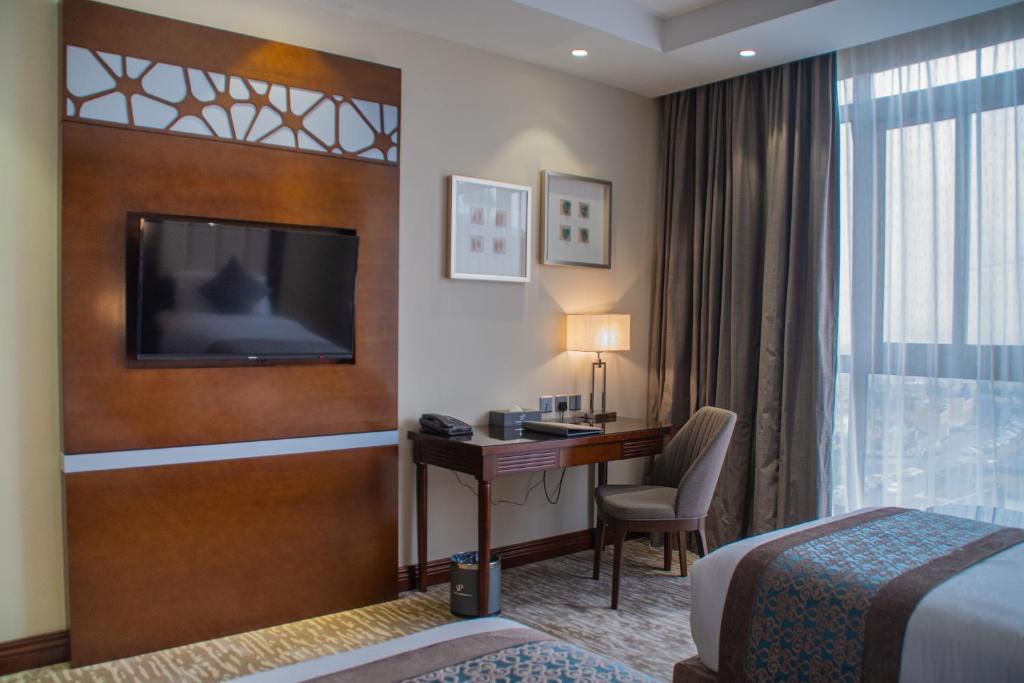Postel nebo postele na pokoji v ubytování Sarwat Park Hotel