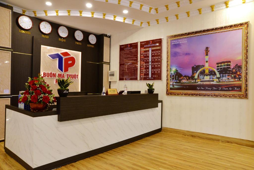 a waiting area of a pdq restaurant with a reception counter at Buon Ma Thuot Hotel in Buon Ma Thuot