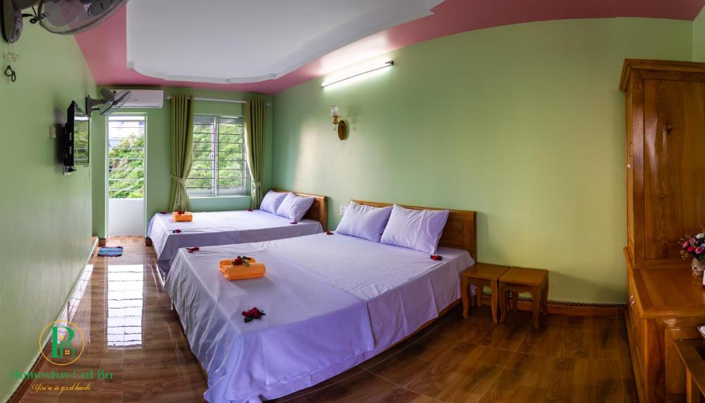 Postel nebo postele na pokoji v ubytování Pi's Homestay CatBa
