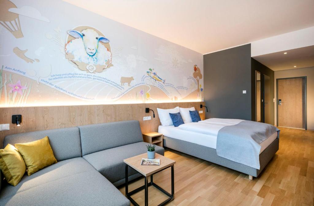 Postel nebo postele na pokoji v ubytování JUFA Hotel Weiz