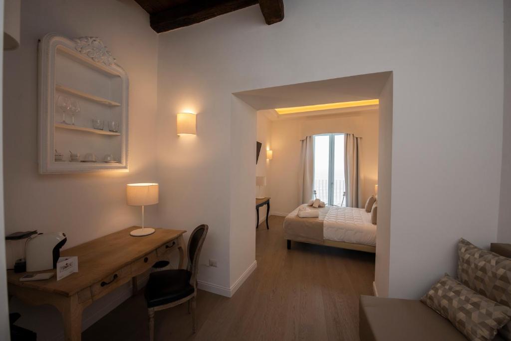 Łóżko lub łóżka w pokoju w obiekcie Domus Centro Tropea