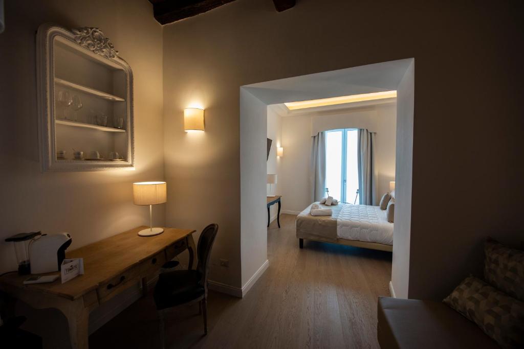 Łóżko lub łóżka w pokoju w obiekcie Domus Centro Tropea