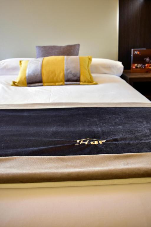 Postel nebo postele na pokoji v ubytování Hotel Armiñe