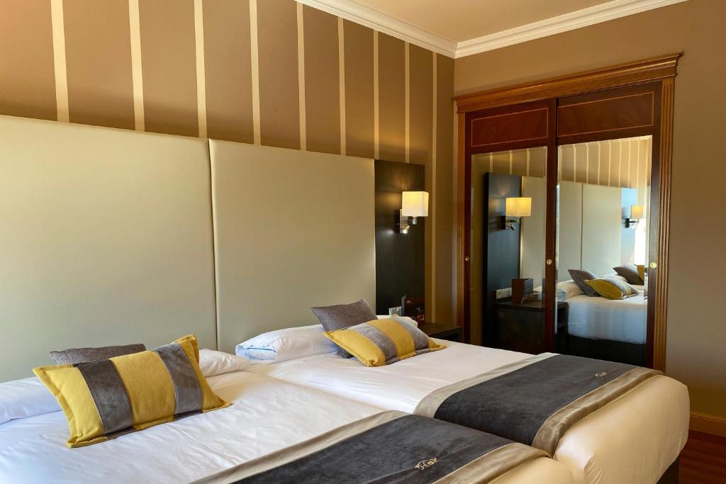 Postel nebo postele na pokoji v ubytování Hotel Armiñe