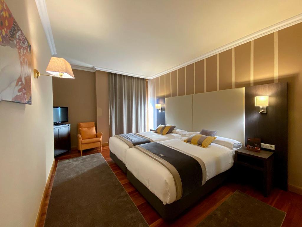 Postel nebo postele na pokoji v ubytování Hotel Armiñe