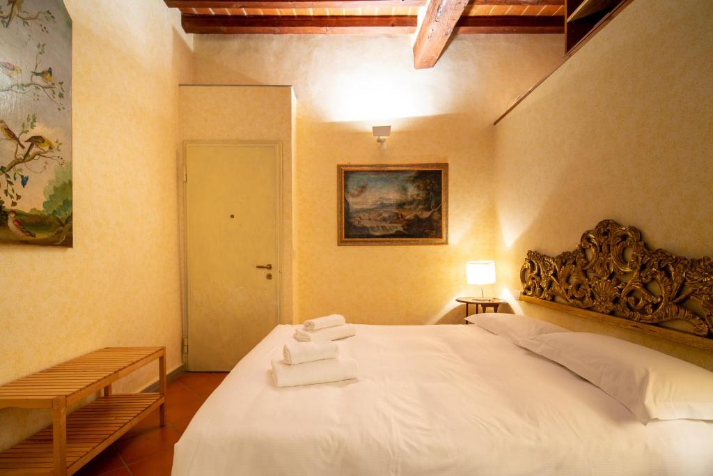 Posteľ alebo postele v izbe v ubytovaní Oltrarno Apartment