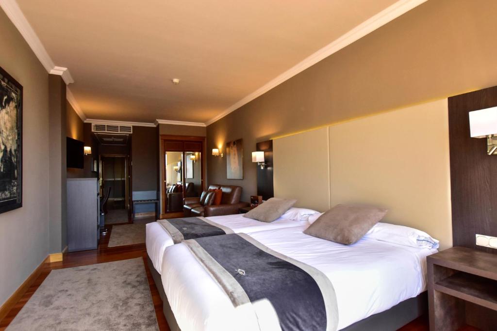 Postel nebo postele na pokoji v ubytování Hotel Armiñe