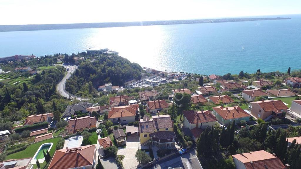 an aerial view of a village next to the water at Apartments Apartim Piran in Piran