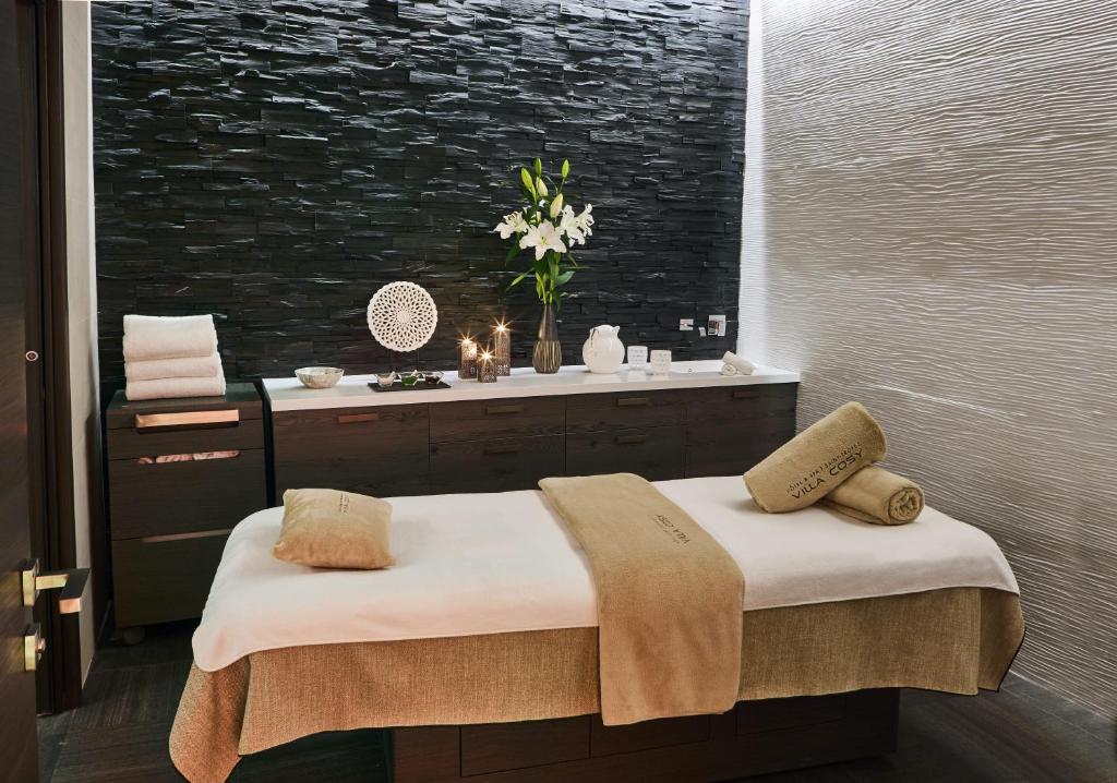a bedroom with a bed and a window with at Villa Cosy, hotel & spa in Saint-Tropez