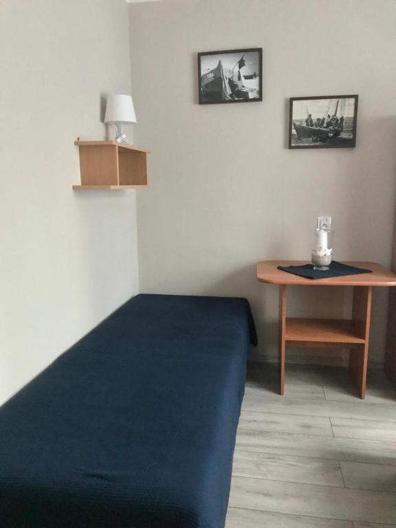 Posteľ alebo postele v izbe v ubytovaní Karwia Pokoje & Apartamenty