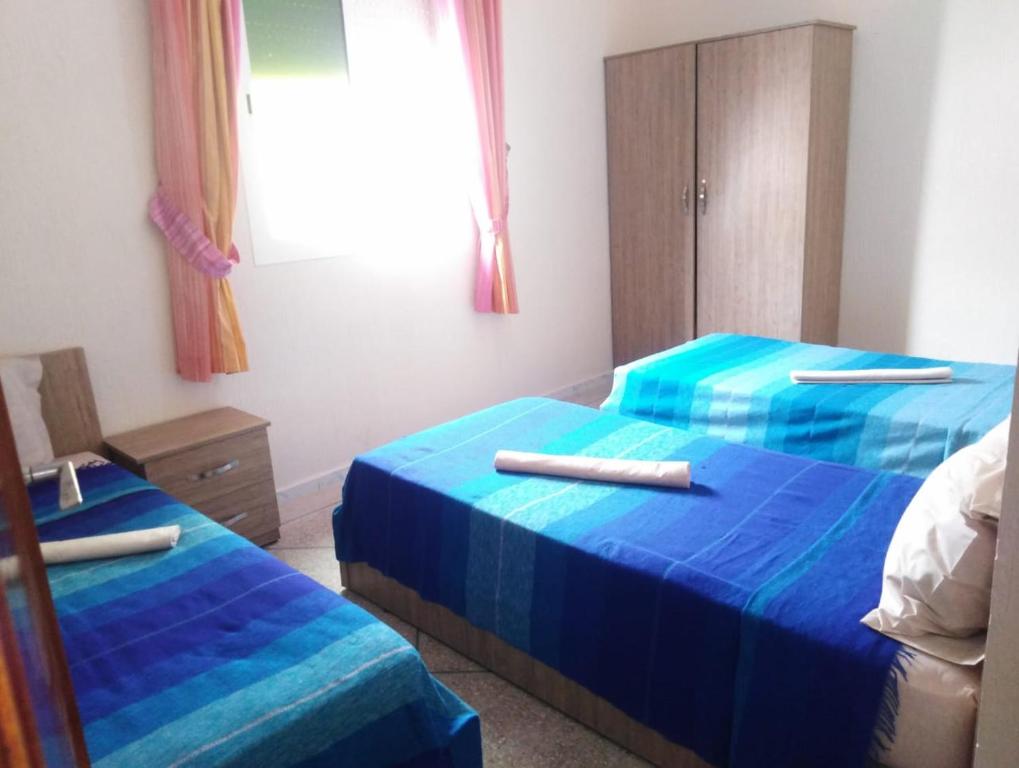 Una cama o camas en una habitación de Mirleft Tayought Guest House