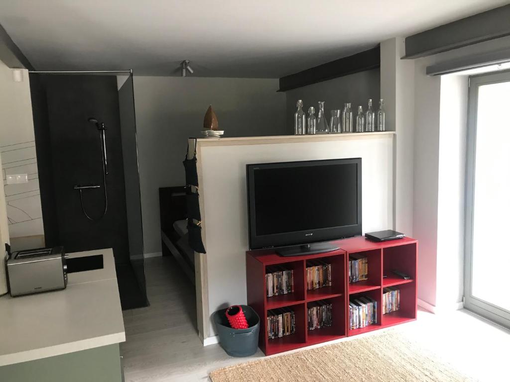 A television and/or entertainment centre at ZiMo Taliándörögdi MoZiHáz